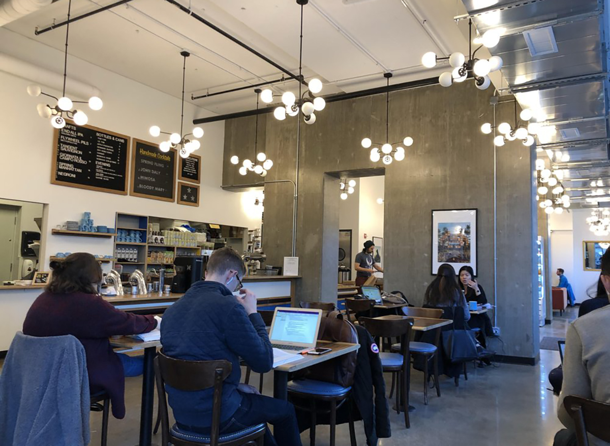 interior of dollop coffee co in chicago with tables and chairs