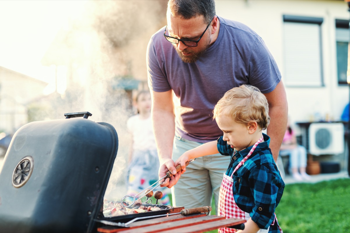 dad and son grilling