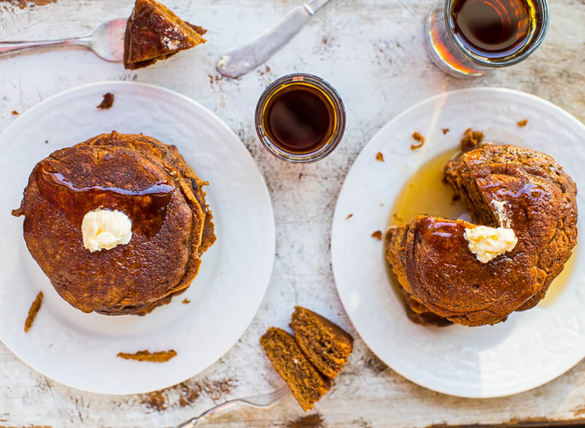 gingerbread molasses pancakes on plates with butter and syrup
