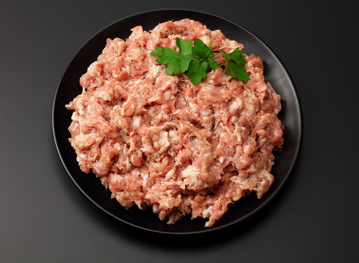 bowl of raw ground pork with seasoning