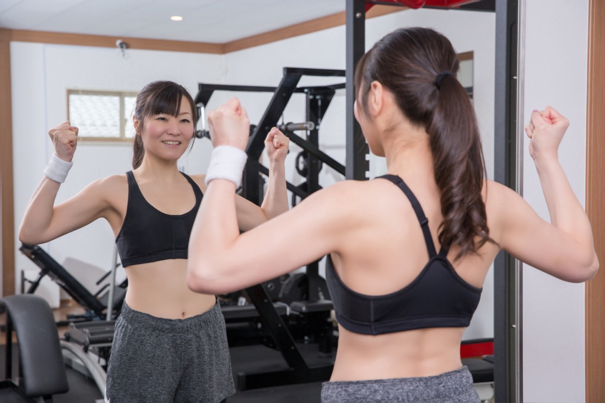 woman client choosing sports clothes in underwear