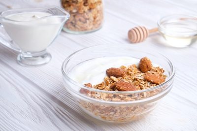 Glass bowl with Greek yogurt and mixed nuts
