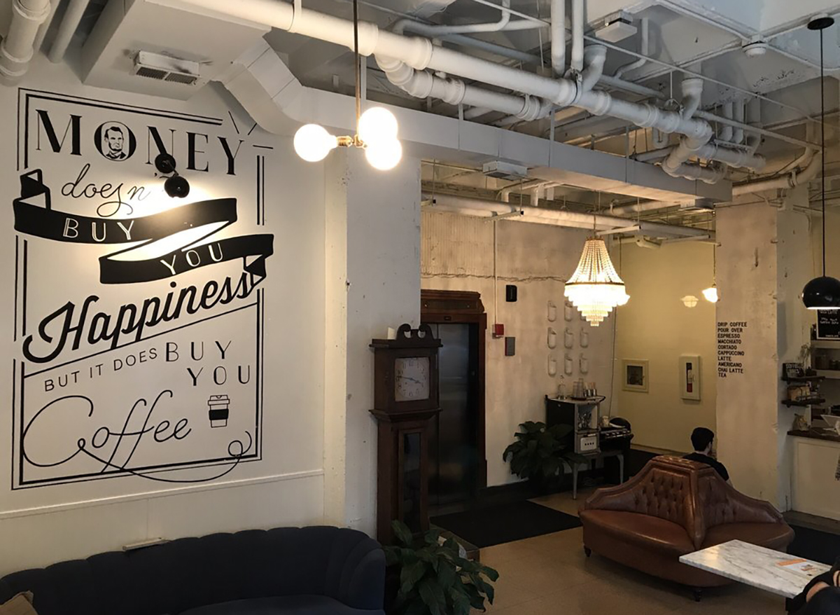 interior of heritage coffee bar in chicago with couch and coffee sign