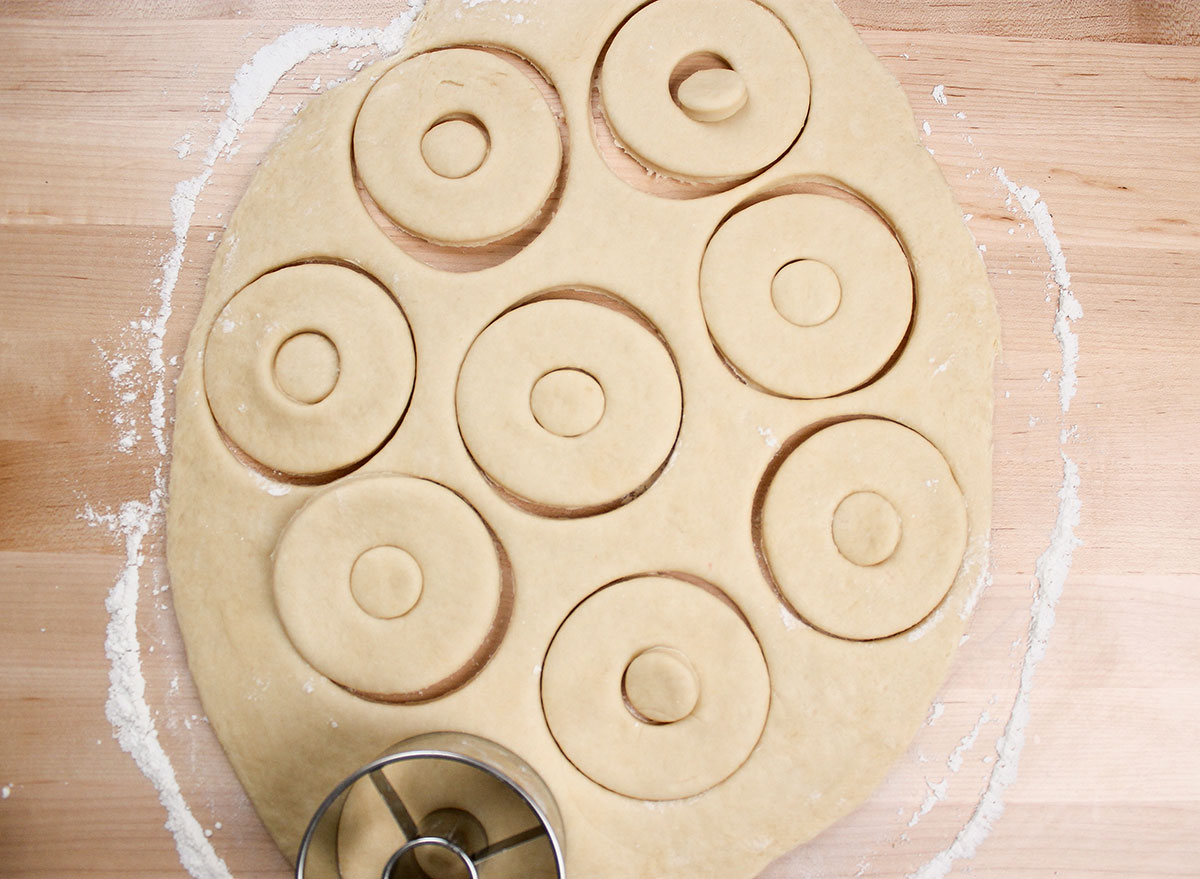 shaping donuts with a donut cutter