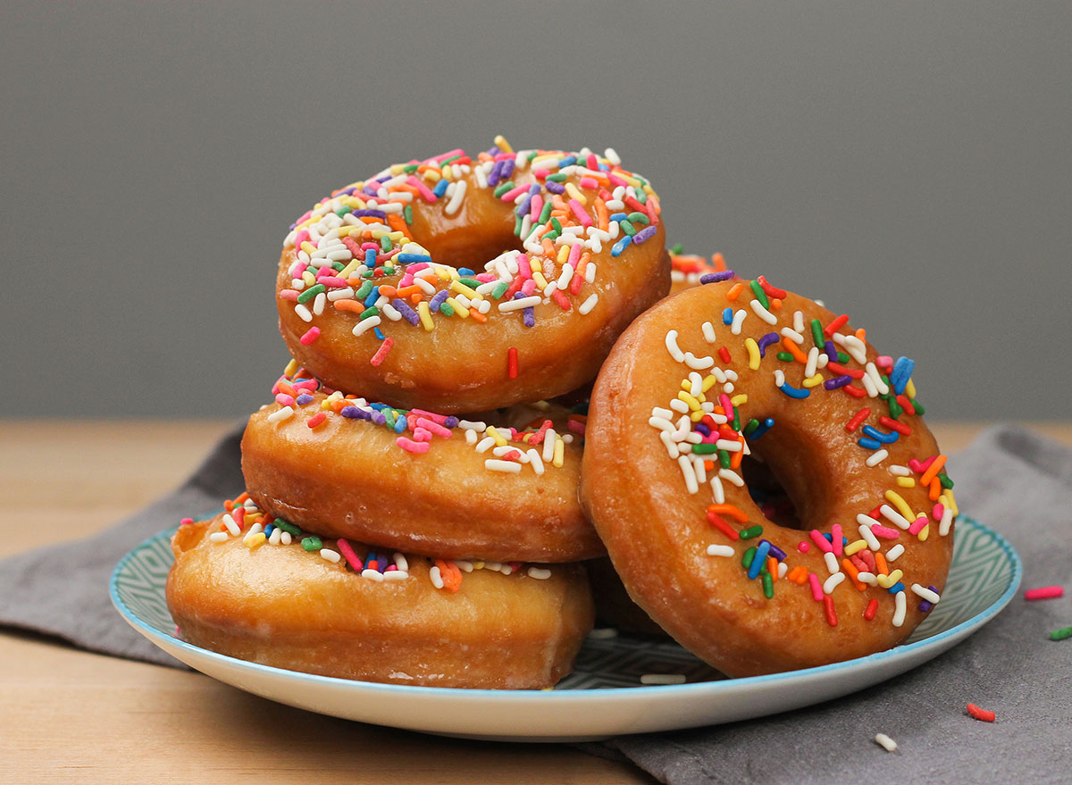 homemade old fashioned donuts with sprinkles on a plate
