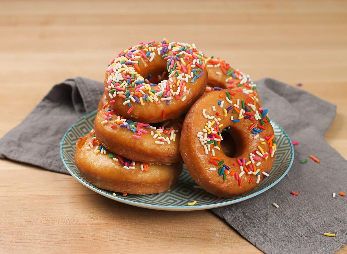 sprinkled donuts on a colorful plate