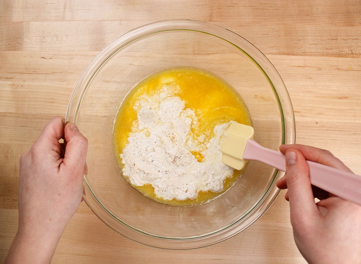 mixing bloomed yeast in butter and egg mixture