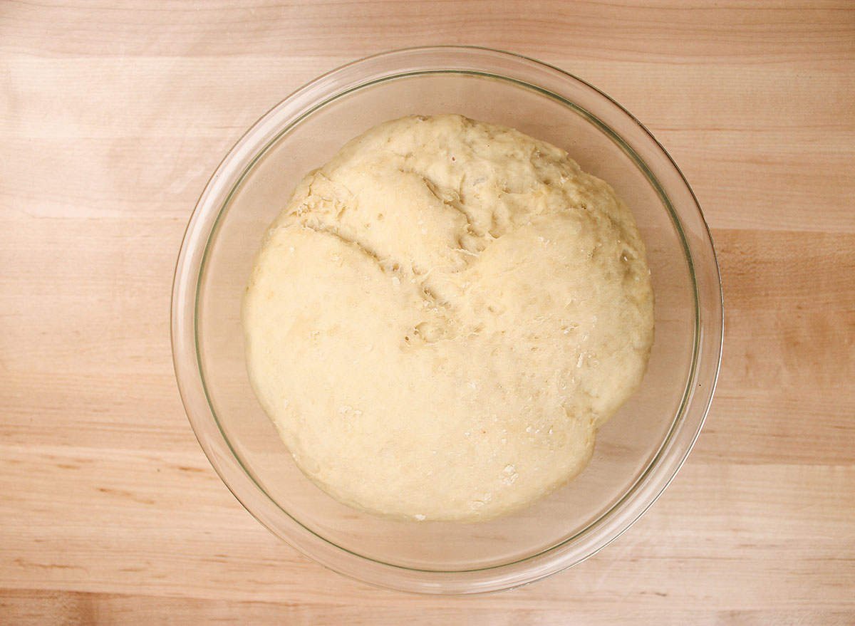 risen dough in a large bowl