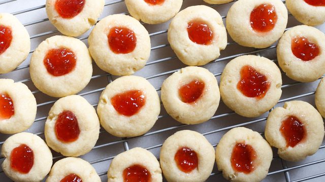 jelly thumbprint cookies on a cooling rack