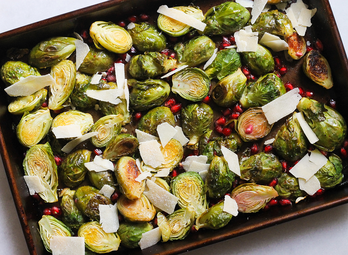 lemon pomegranate brussels sprouts on a sheet pan
