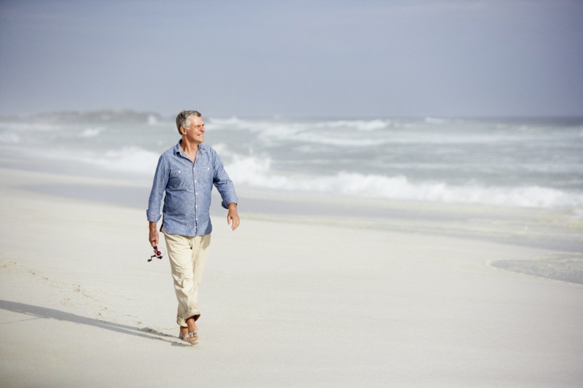 man walking on beach