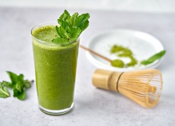 matcha mint smoothie garnished with mint