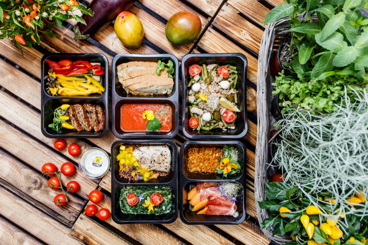 Healthy food and diet concept, restaurant dish delivery. Take away of fitness meal. Weight loss nutrition in foil boxes