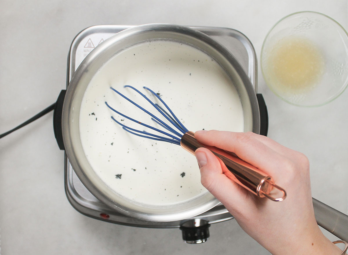 whisking panna cotta mixture in a pot