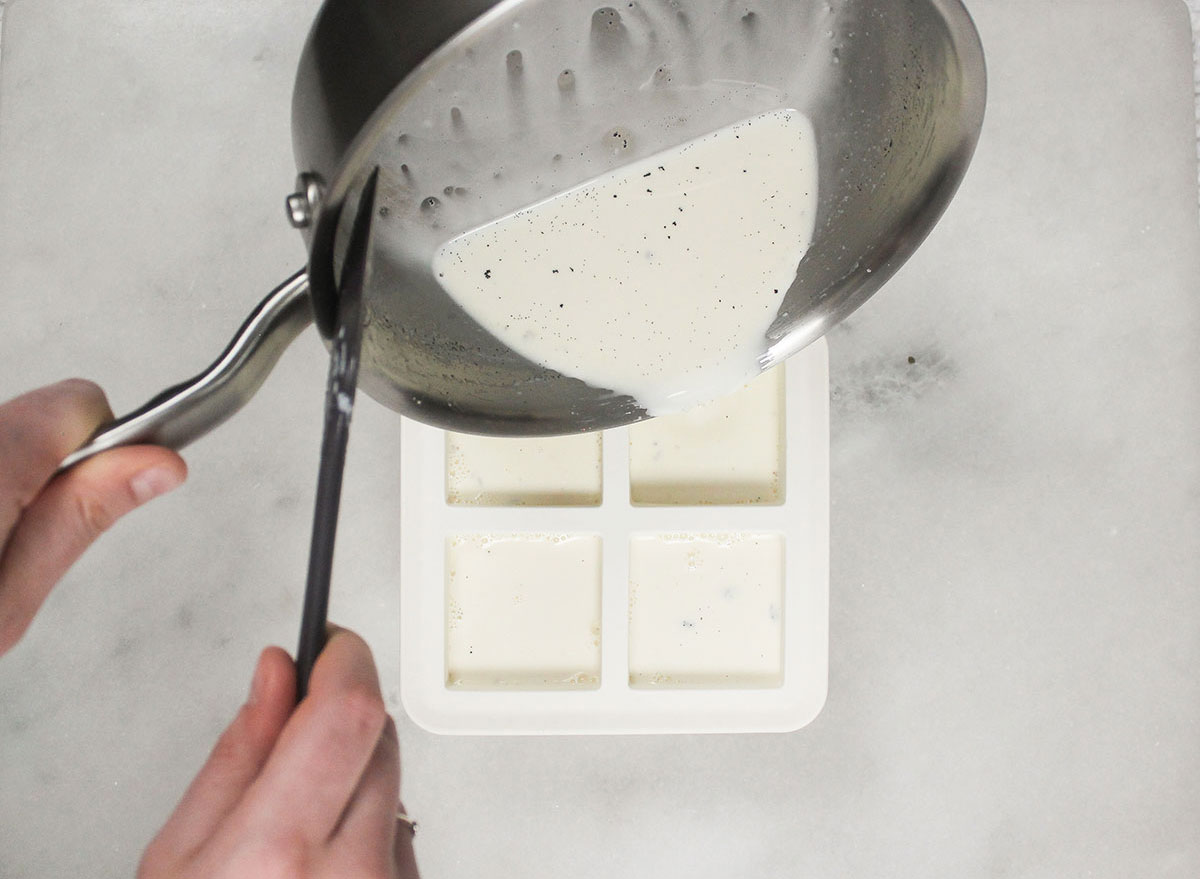 pouring panna cotta mixture into molds