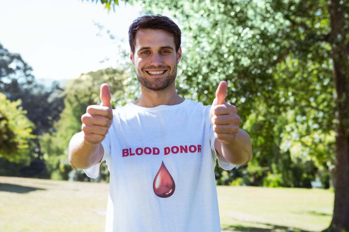 Blood donor smiling at camera on a sunny day