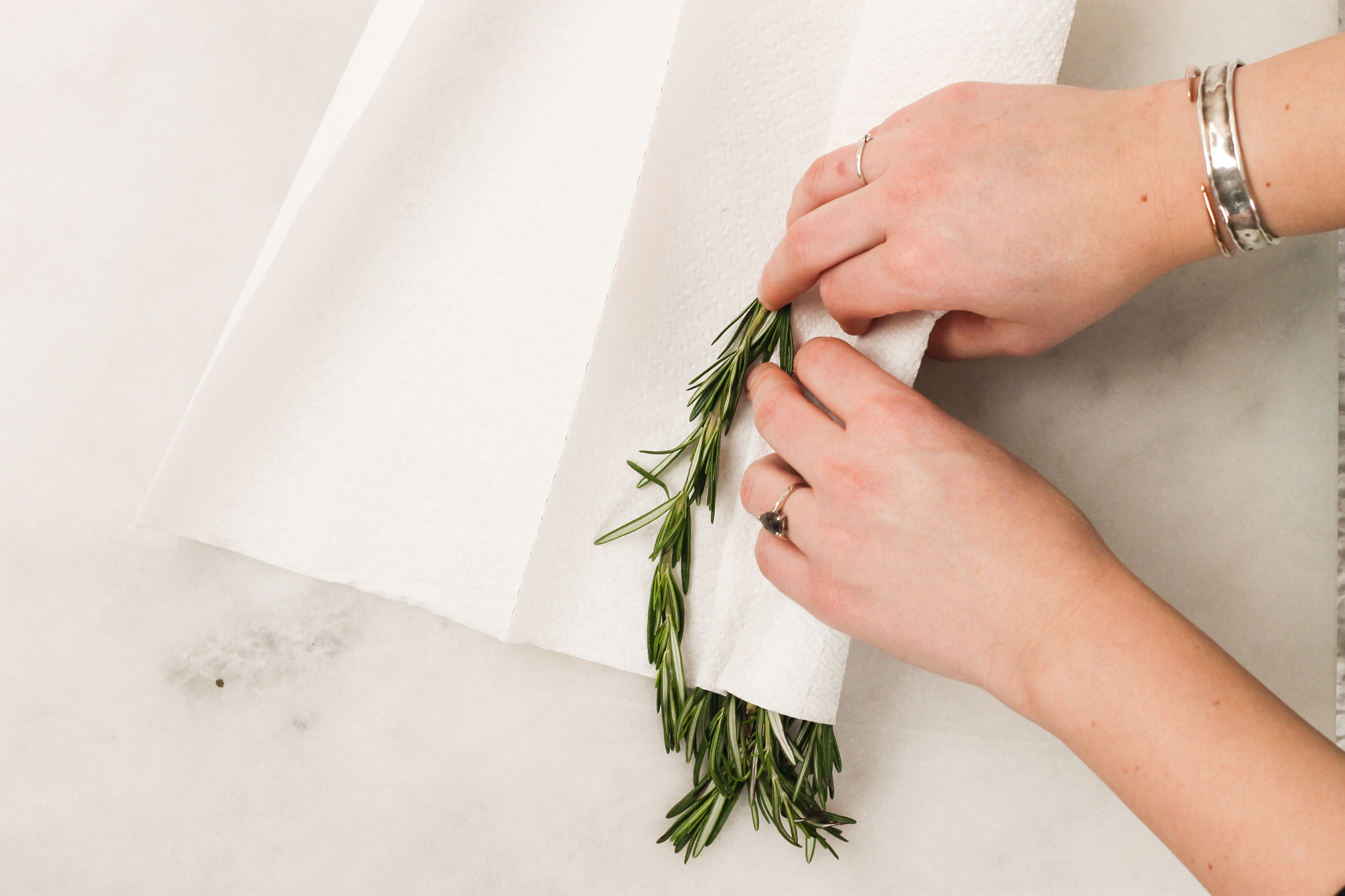 rolling rosemary in paper towels