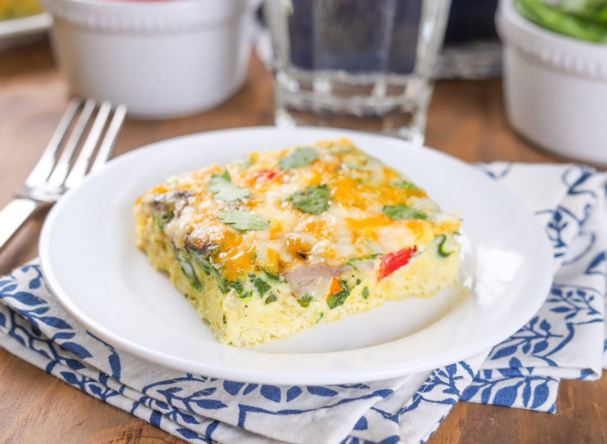 vegetable egg bake on white plate with fork