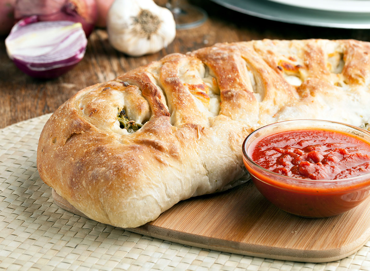 vegetable stromboli on wood cutting board