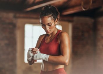 Female boxer wearing strap on wrist