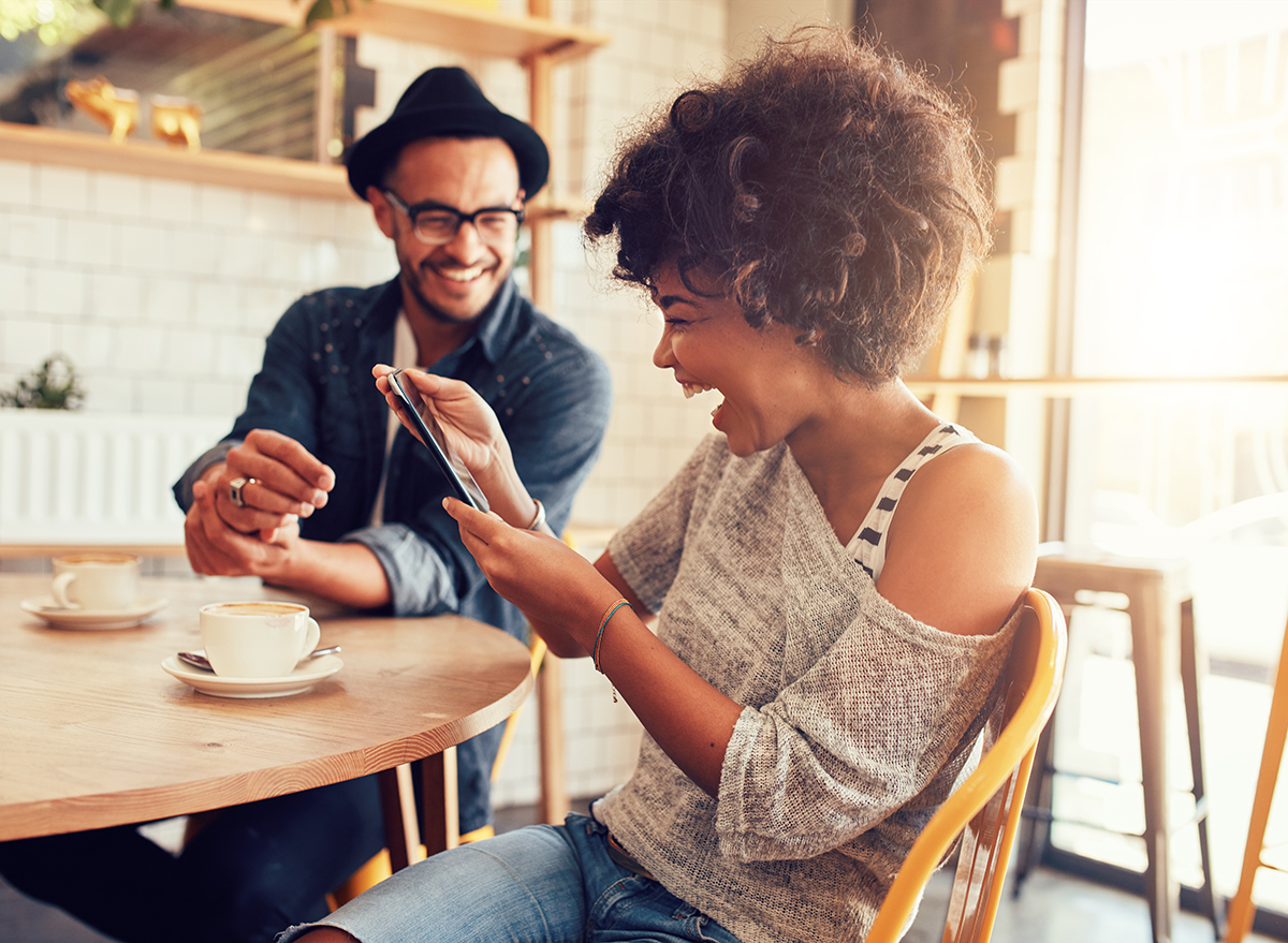 woman laughing at phone