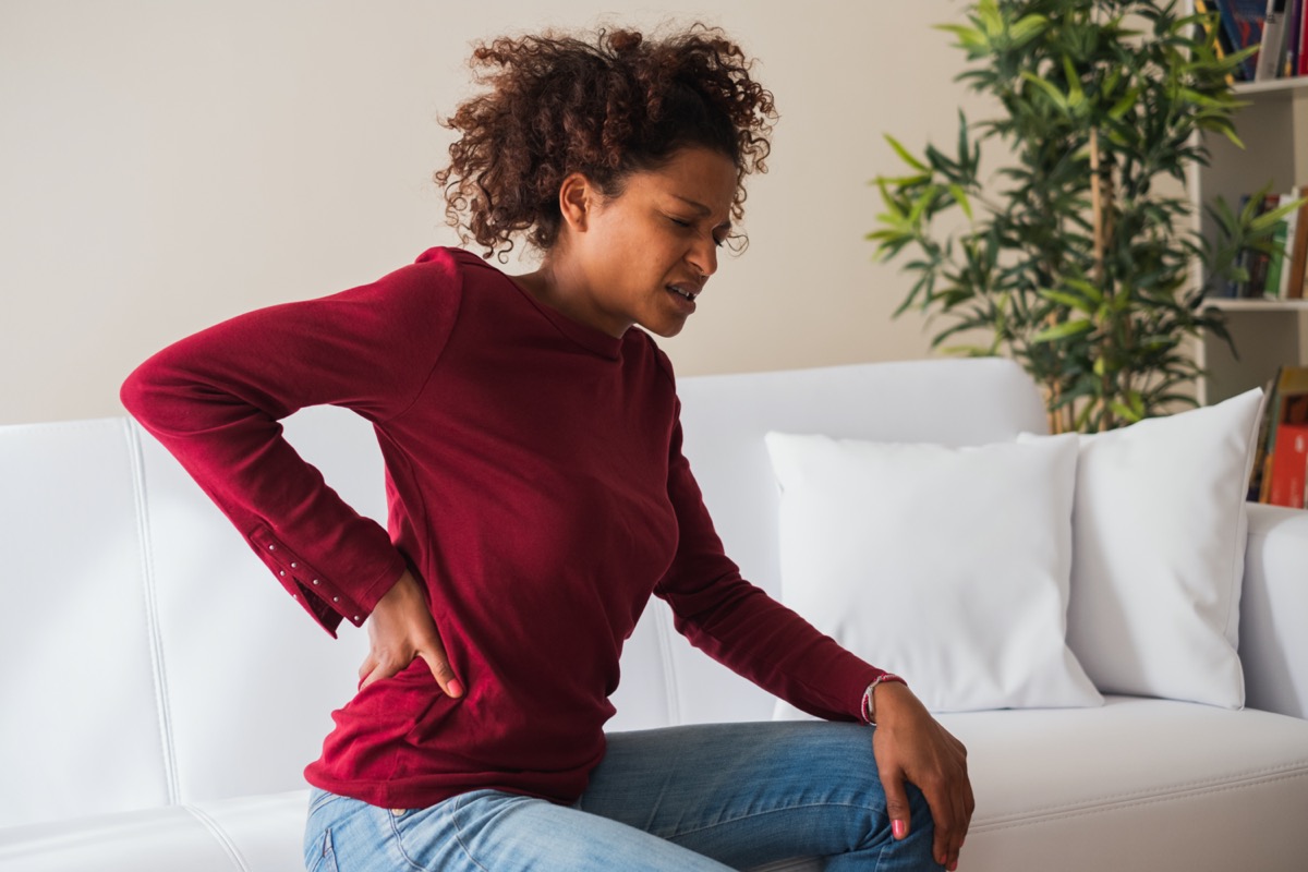 woman suffer back pain cramp