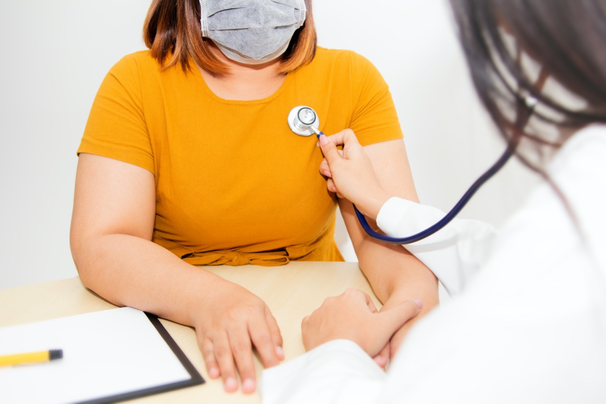 Woman obese overweight face mask doctor check