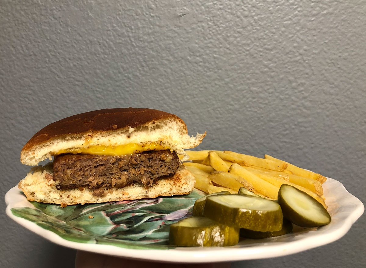 cooked beyond burger with fries and pickles