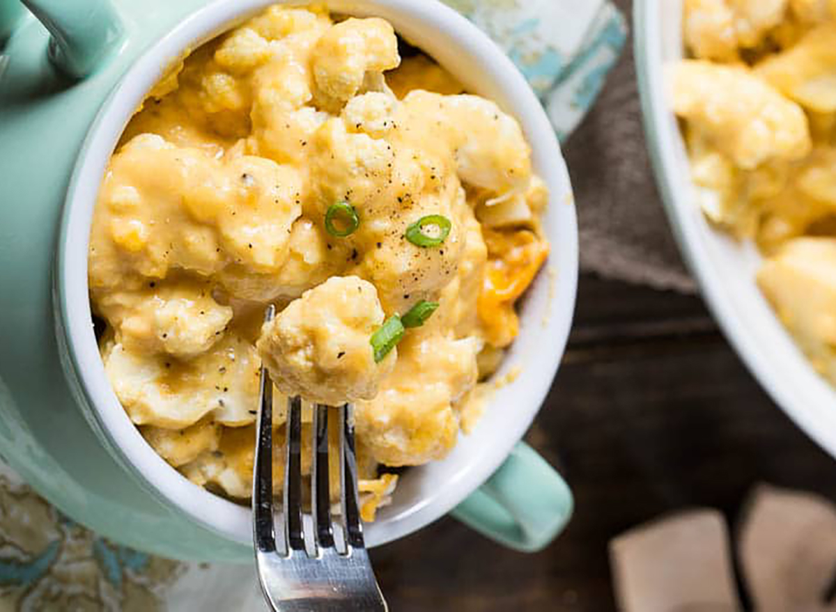 cauliflower and cheese in bowl with fork