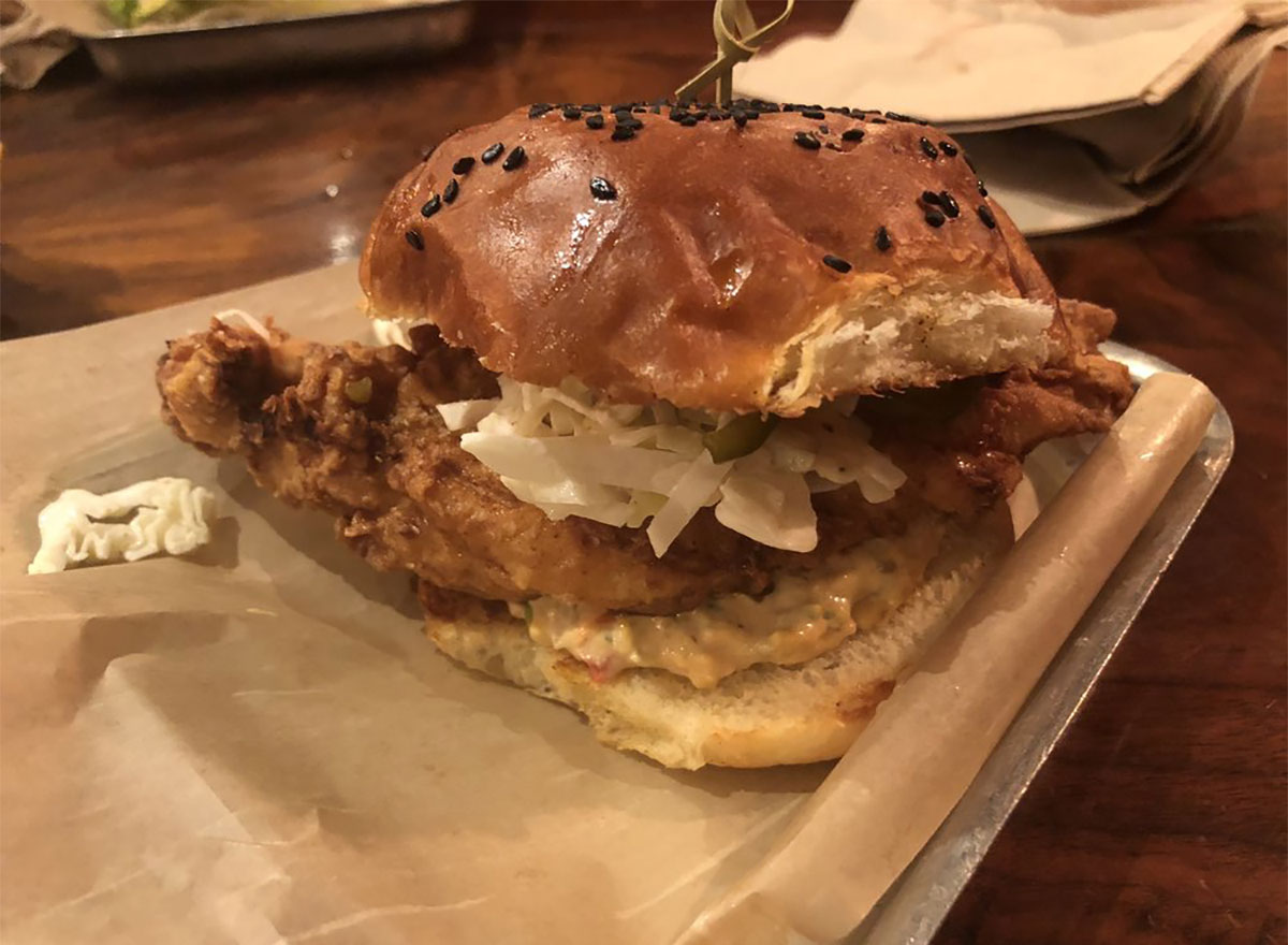 fried chicken sandwich from district donuts in louisiana