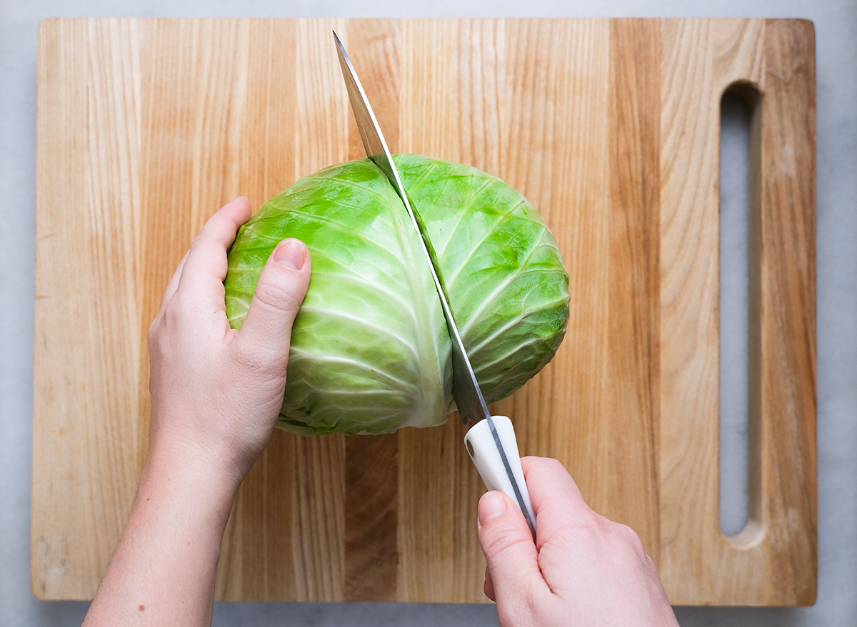 cutting into a cabbage