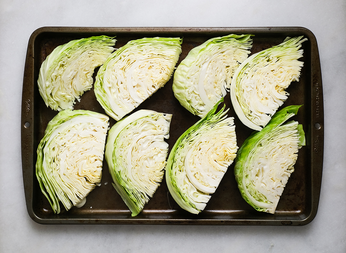 cabbage wedges on a baking sheet