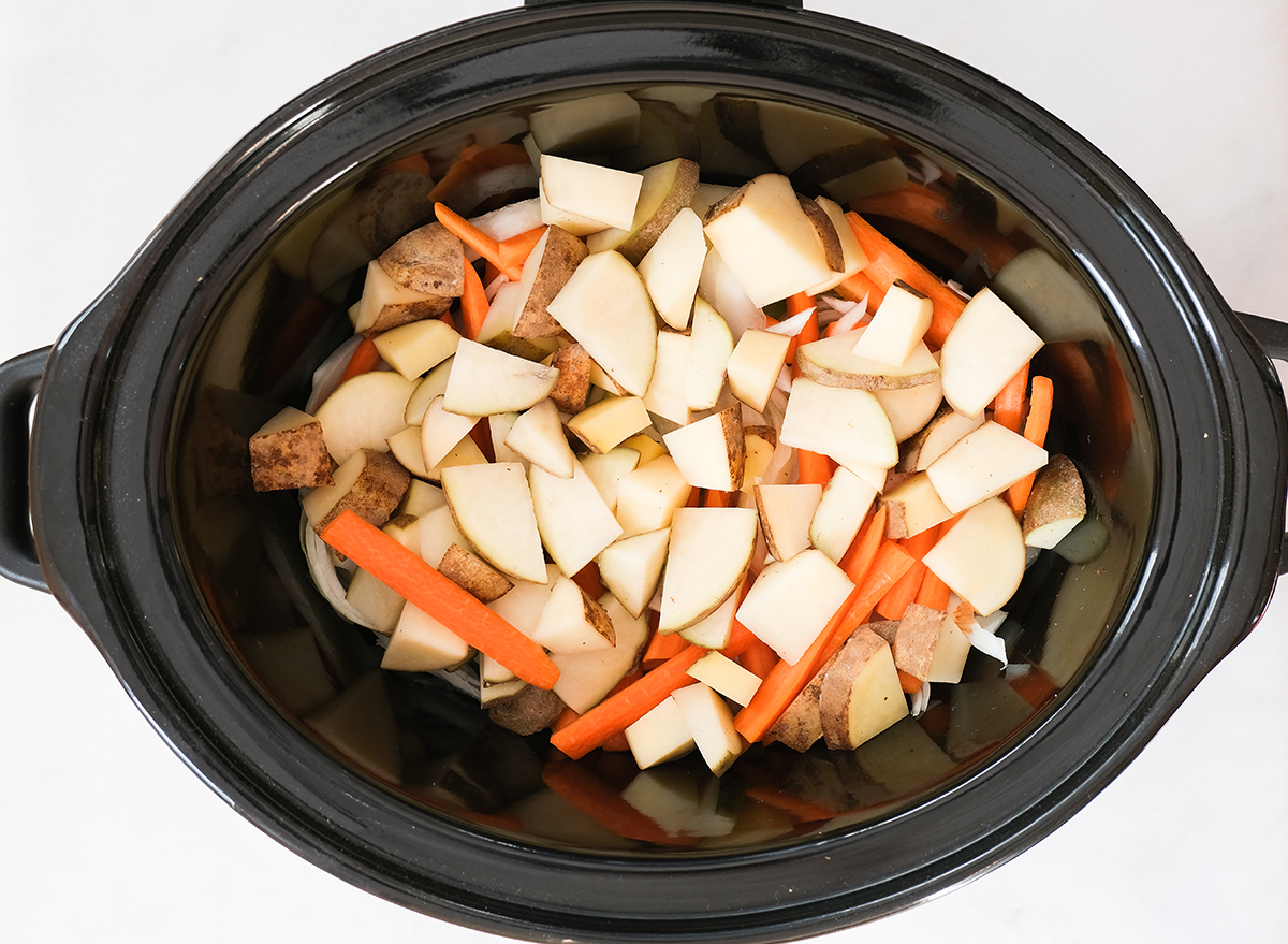 chopped vegetables in a slow cooker