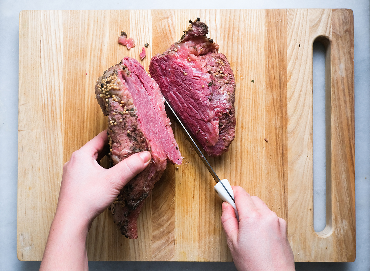 cutting into corned beef