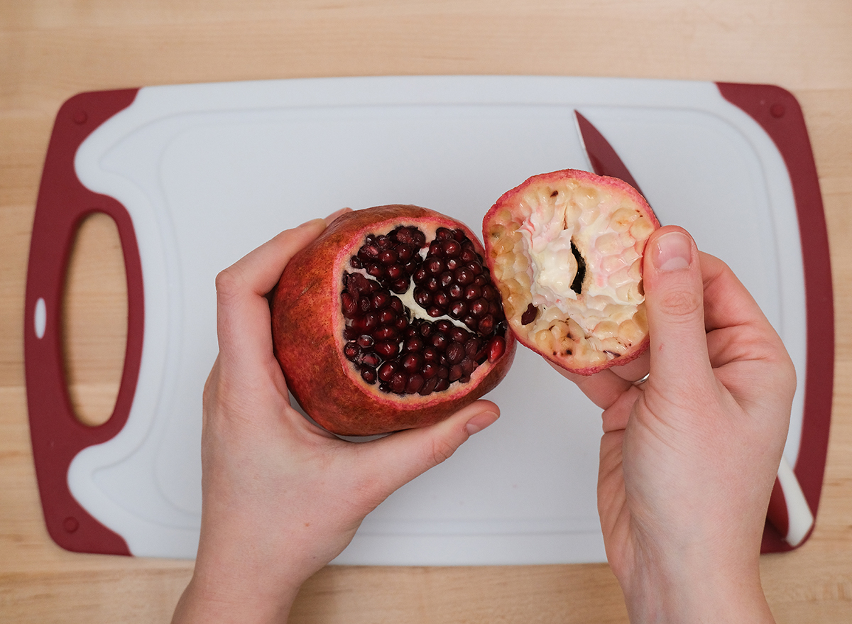 removing the top of a pomegranate