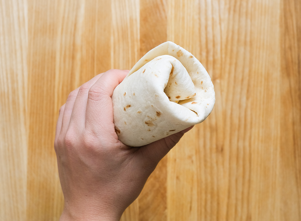 https://www.eatthis.com/wp-content/uploads/sites/4/2020/01/how-to-fold-a-burrito-6.jpg?quality=82&strip=1