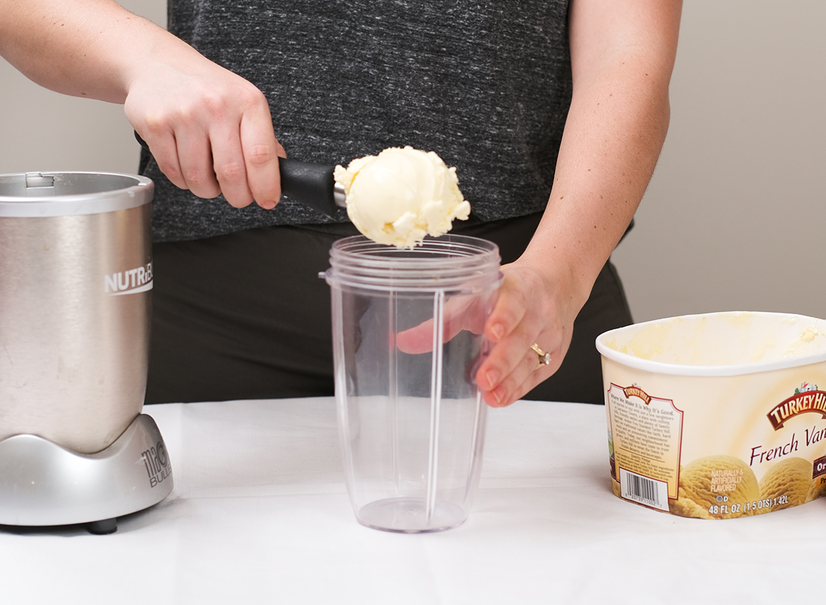 adding ice cream to a blender