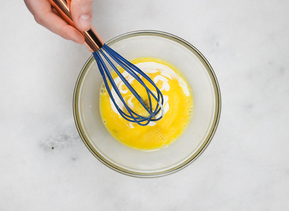 whisking together eggs and heavy cream
