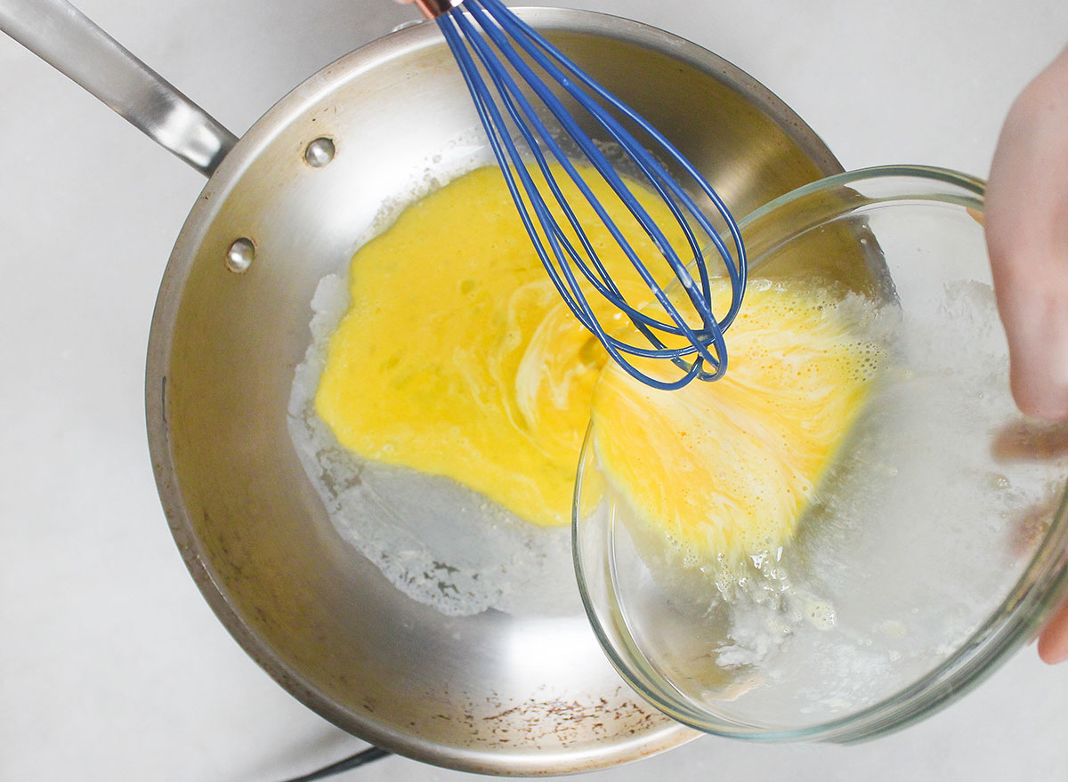 pouring the egg mixture onto a nonstick pan
