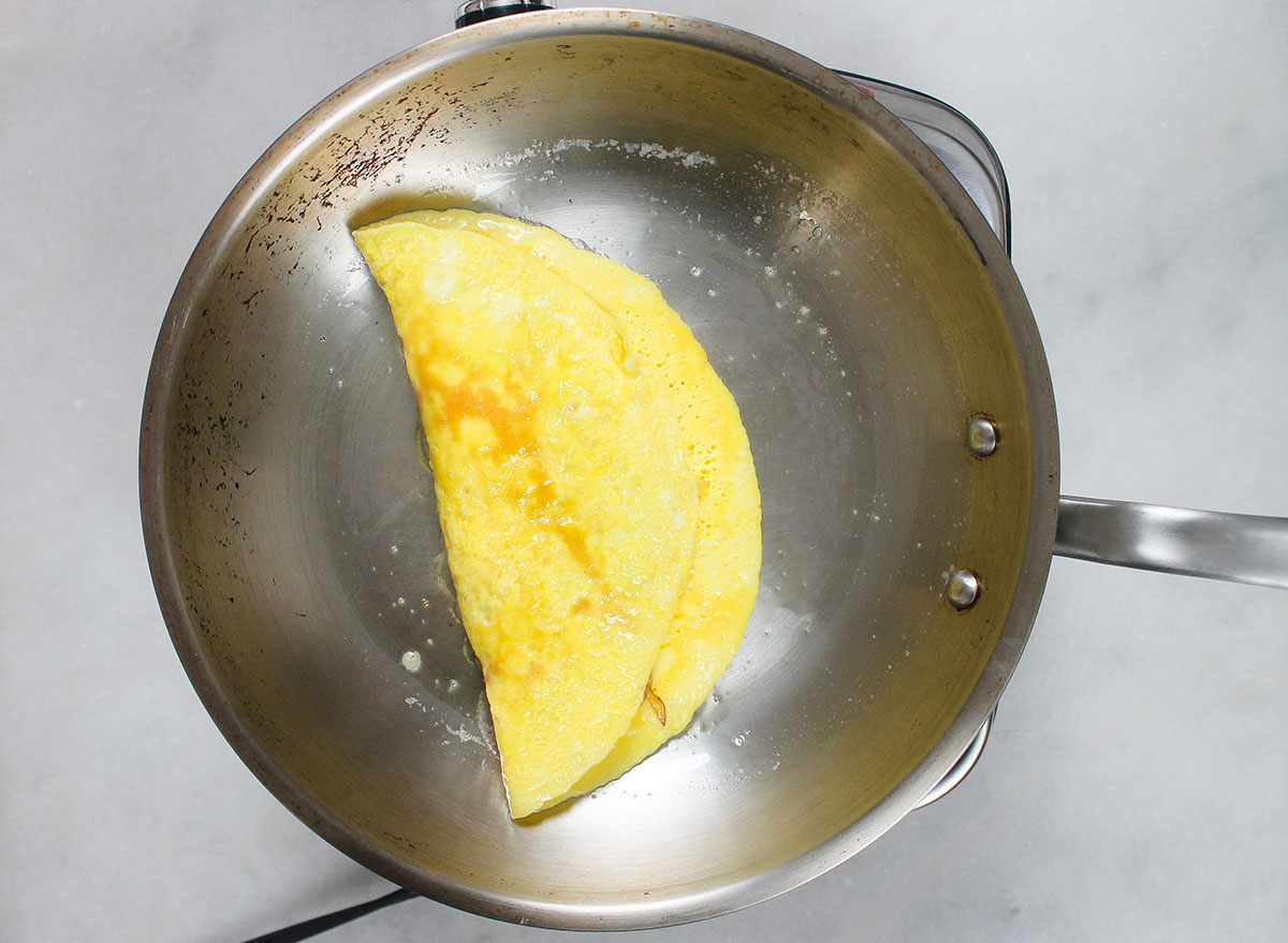 flipped omelet on a pan