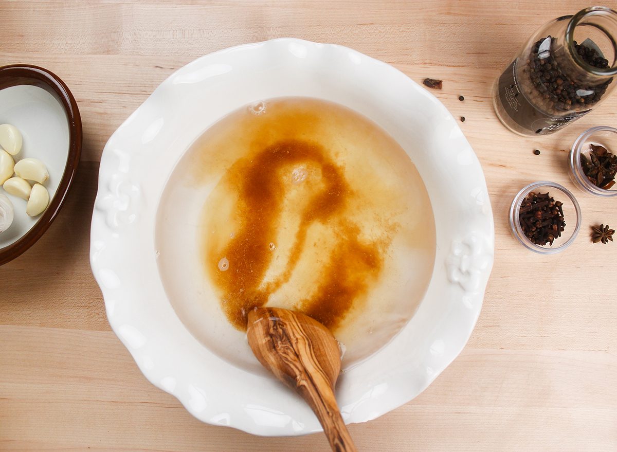 mixing brown sugar in a bowl with water