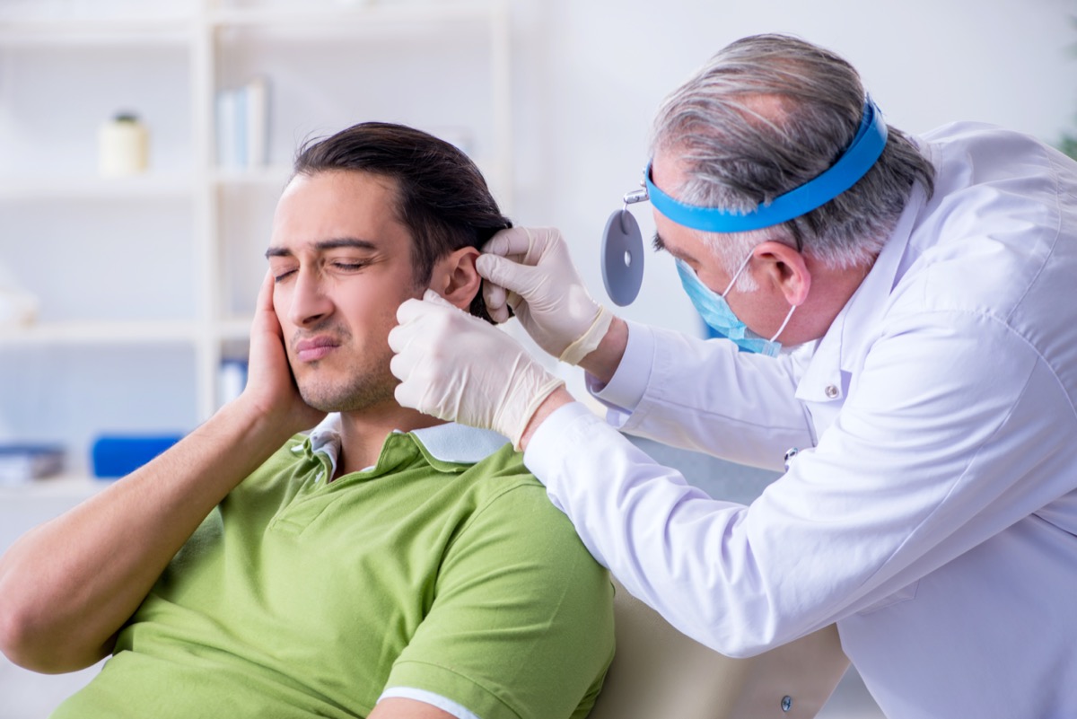 Male patient visiting doctor otolaryngologist