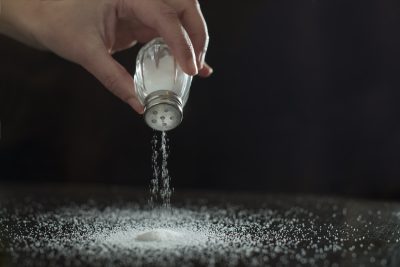 Adding salt. Backlight to salt from salt shaker.