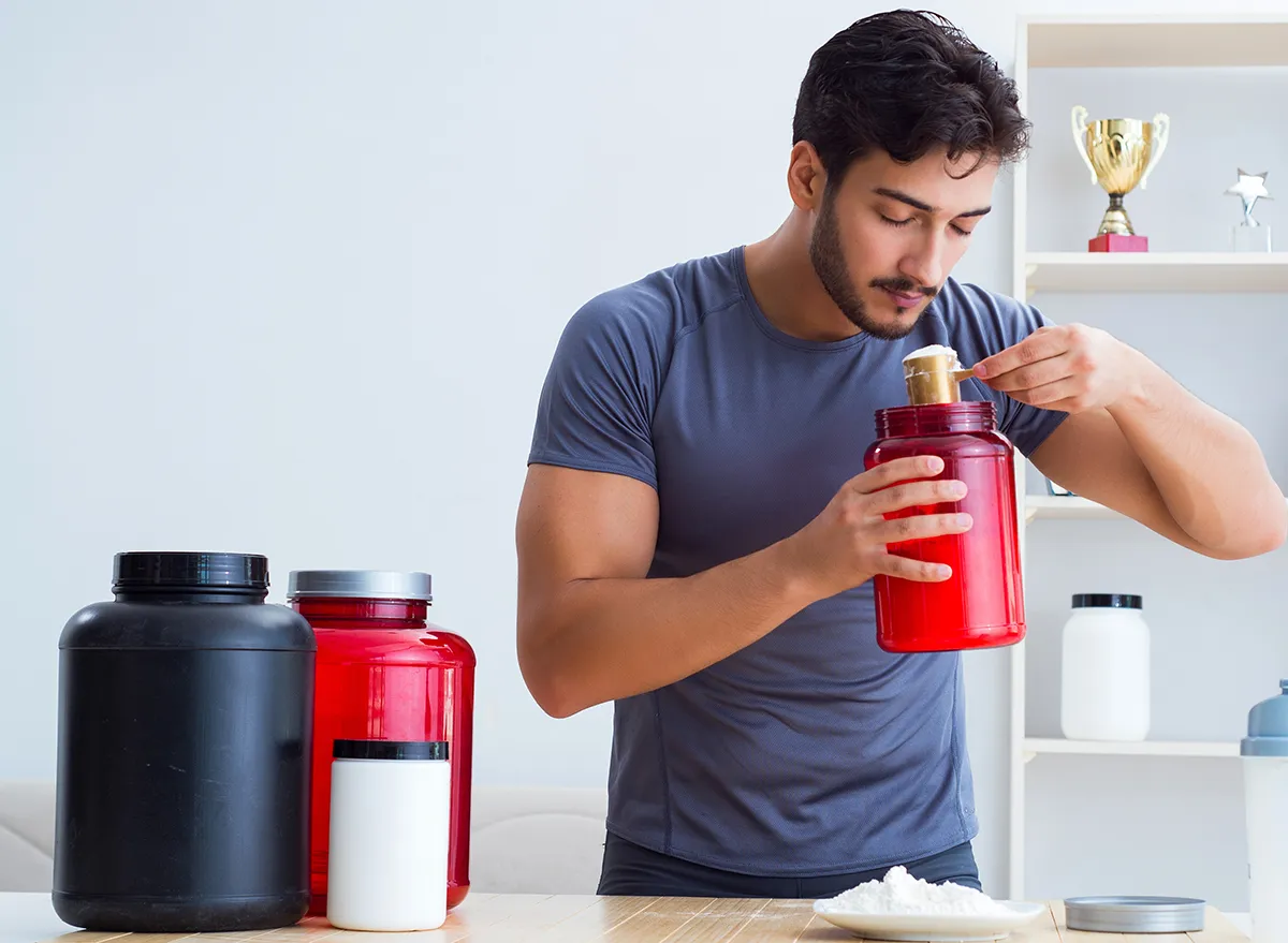 man using protein powder