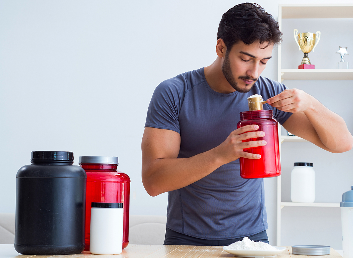 man using protein powder