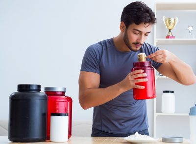 man using protein powder