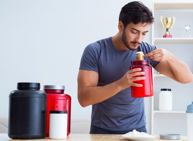 man using protein powder