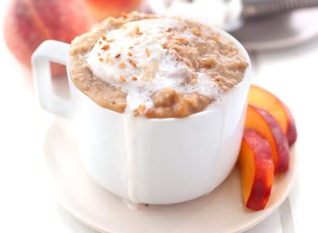 serving of peach cobbler oatmeal with peach slices