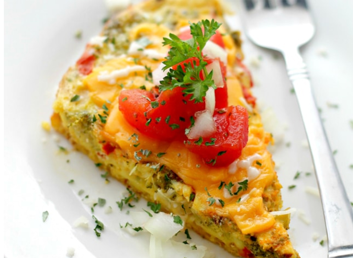 slow cooker vegetable omelette slice on plate with fork