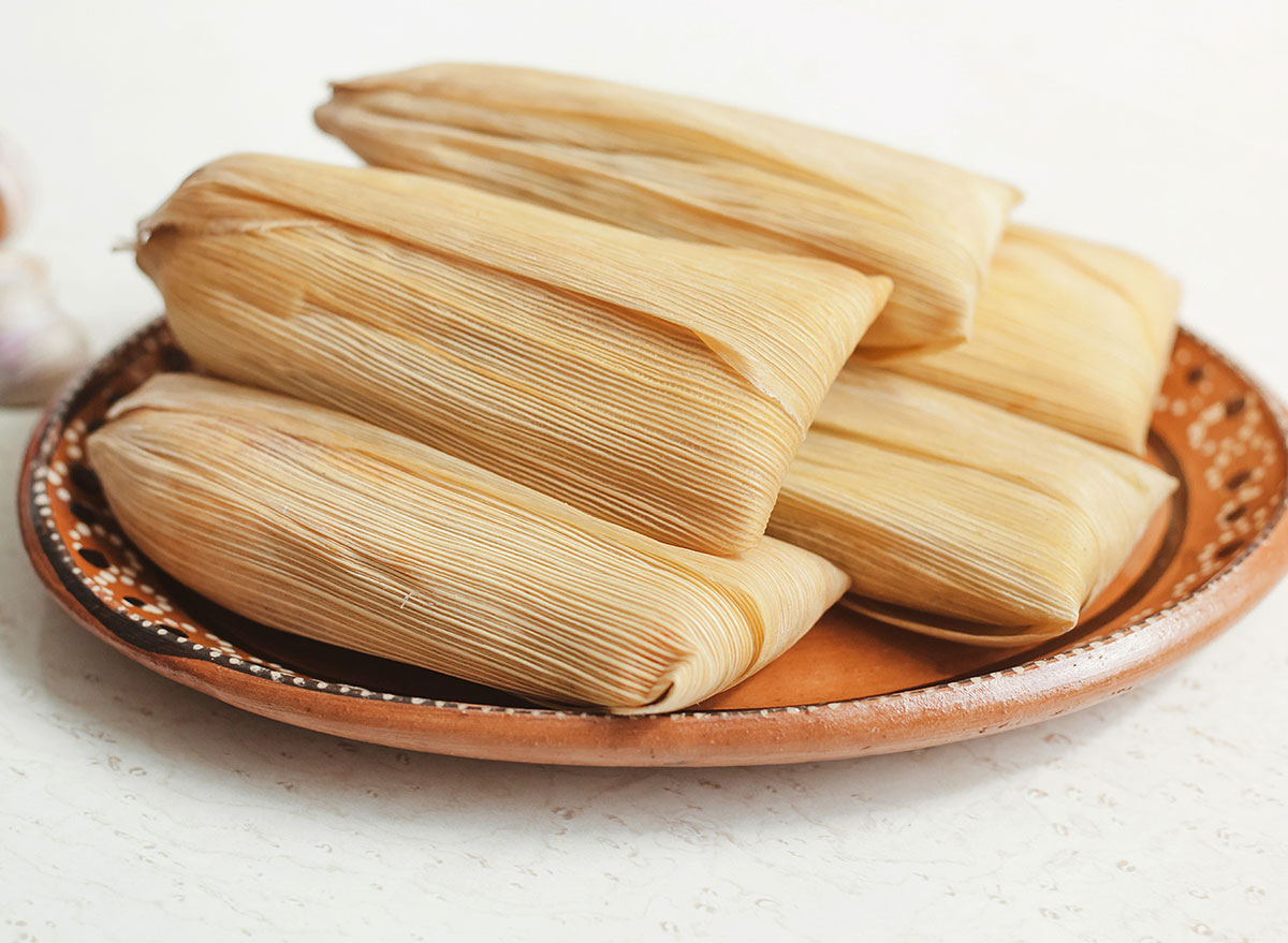 tamales piled on a plate